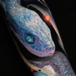 A blue snake sleeve with roses