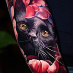 A black cat in flower