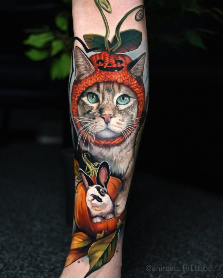 a cat with a pumpkin hat and bunny