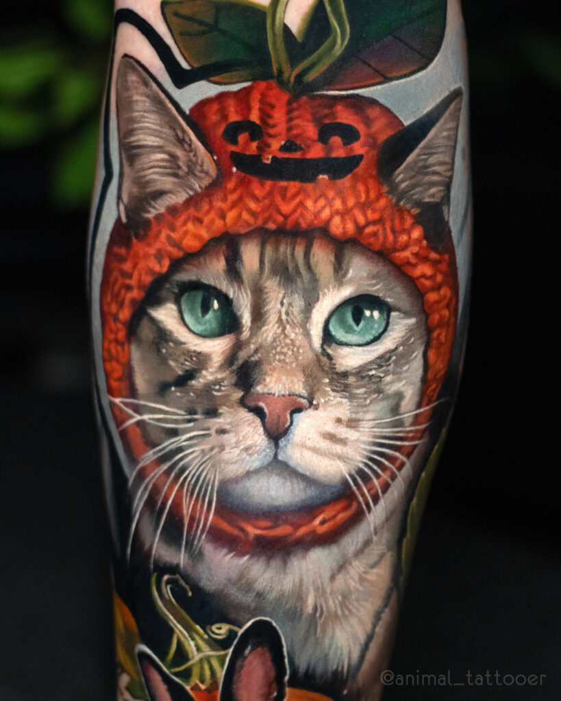 a cat with a pumpkin hat and bunny